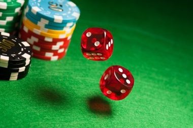 live dealer at blackjack table with player cards visible